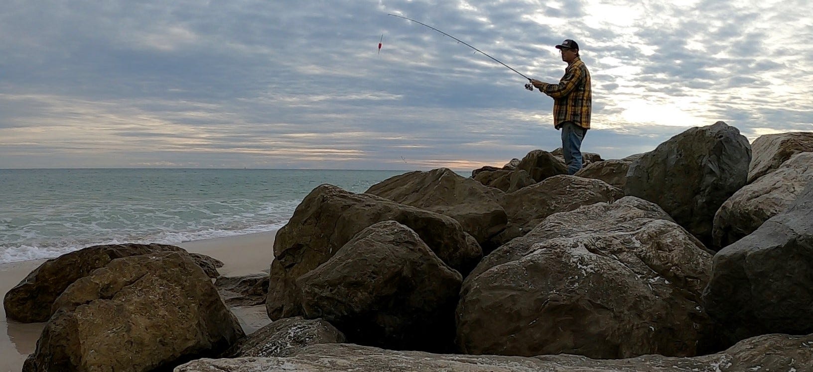 shore fishing with popping cork