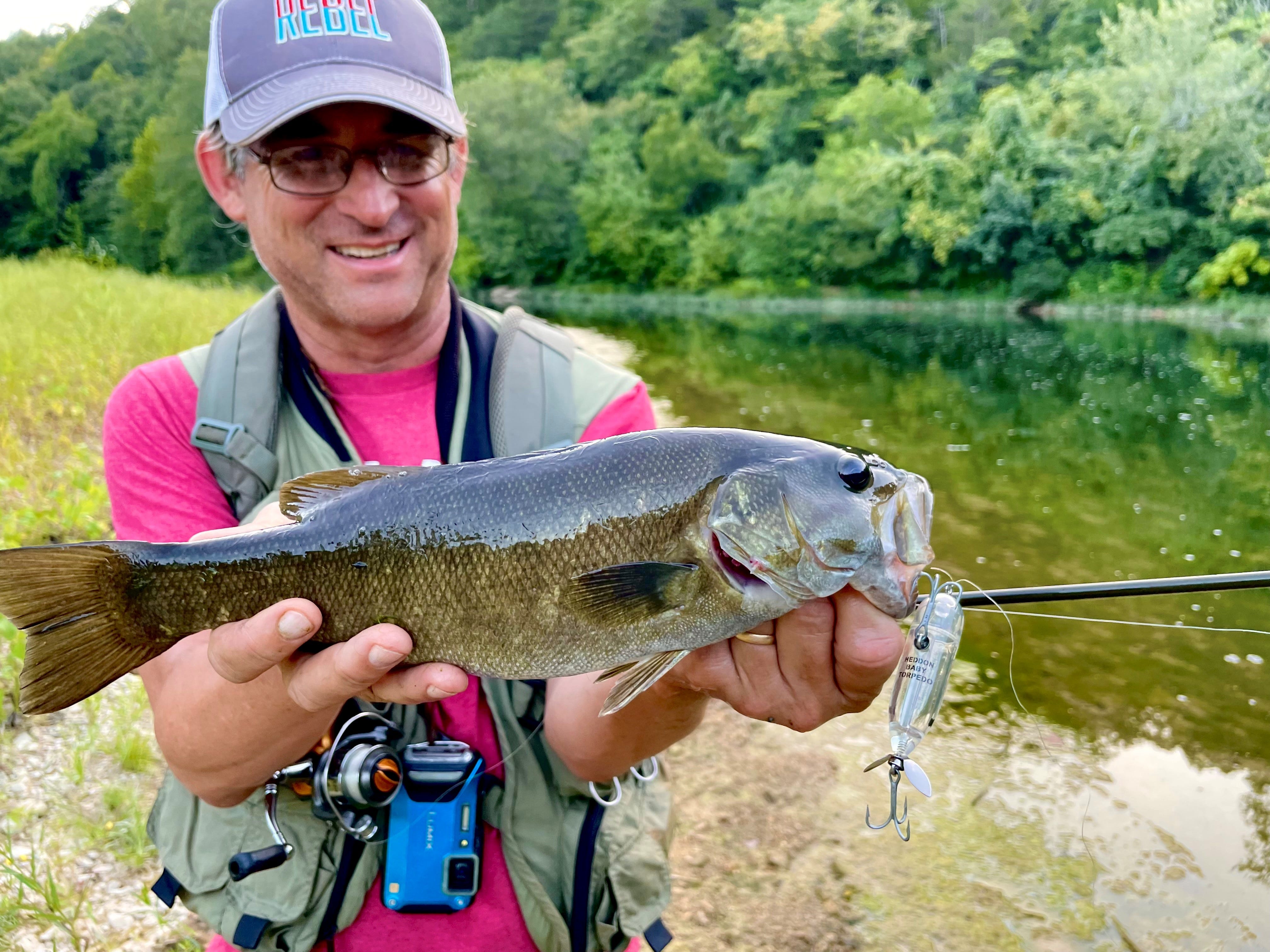 creek smallmouth on topwater lure