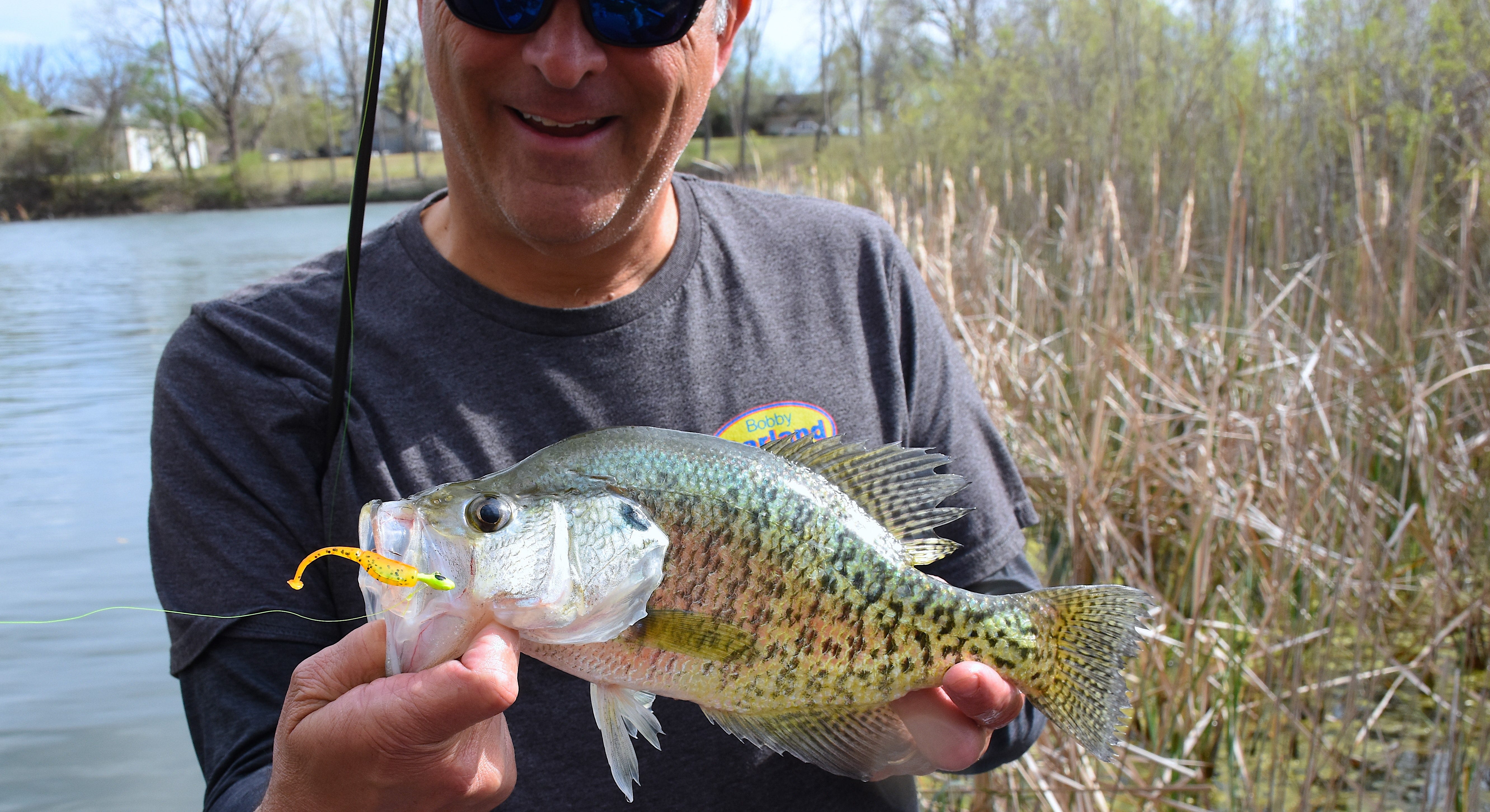 Happy angler with spring crappie