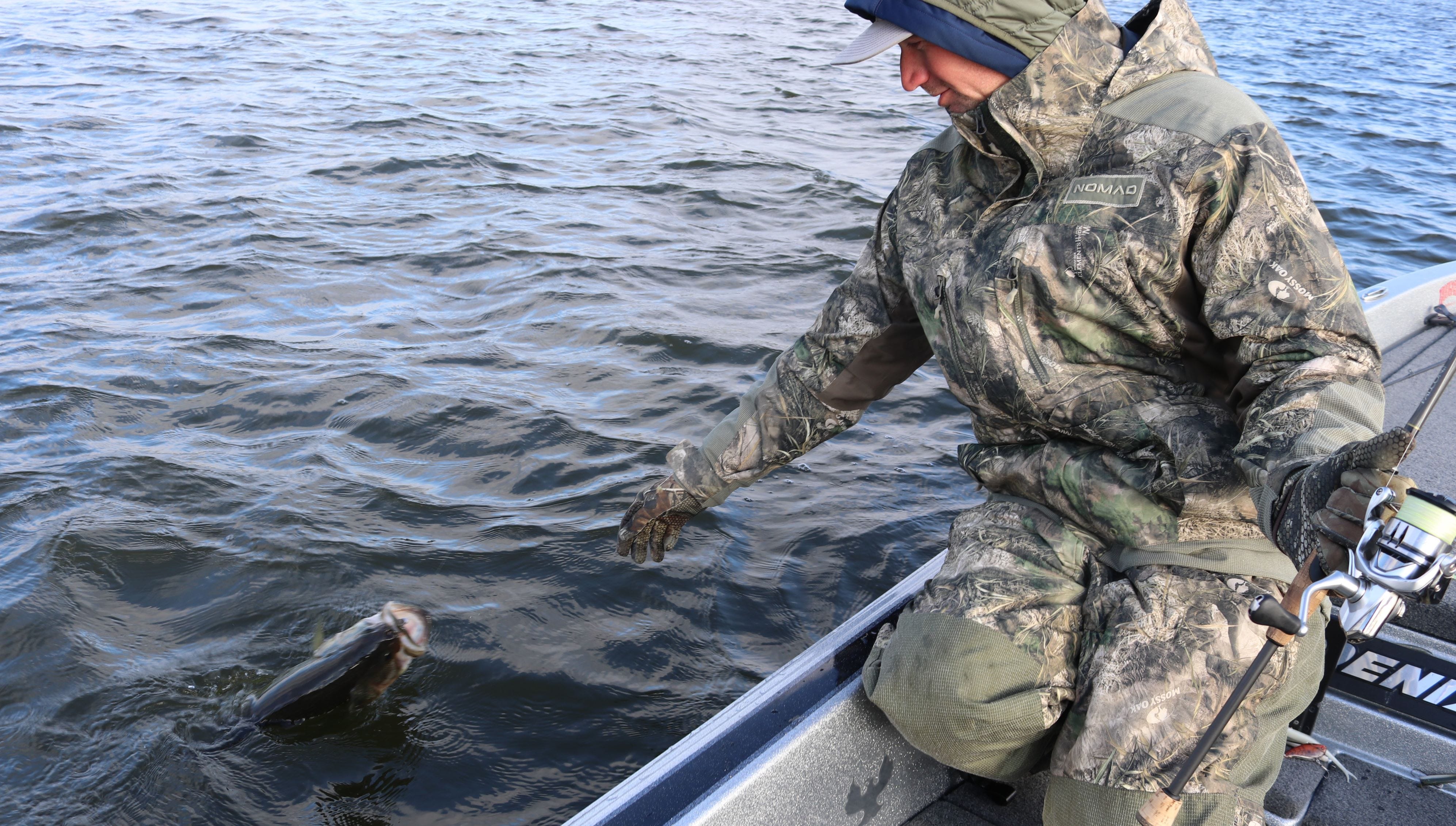Luke Palmer landing a winter bass