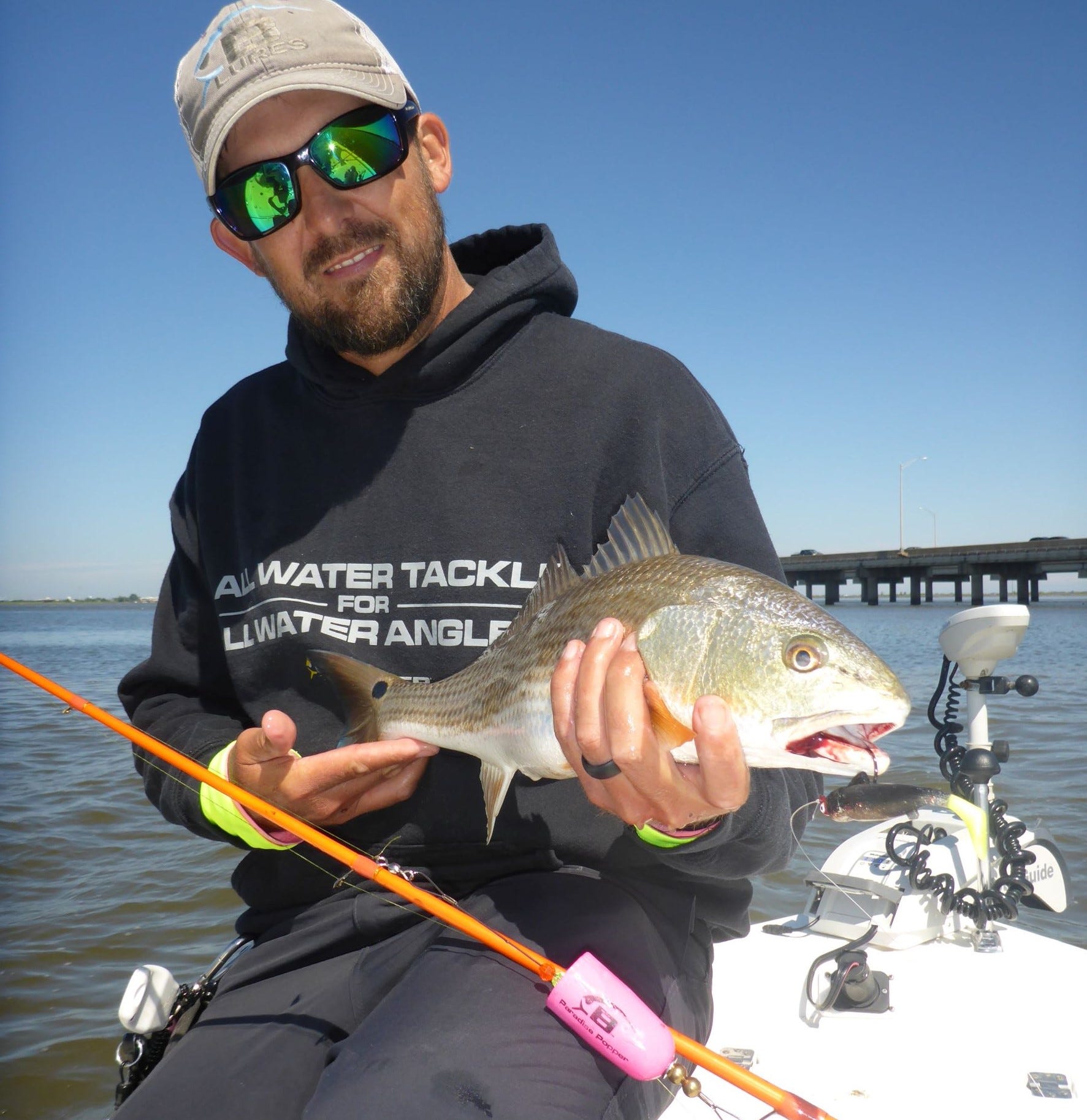 Patric Garmeson wiht popping cork redfish