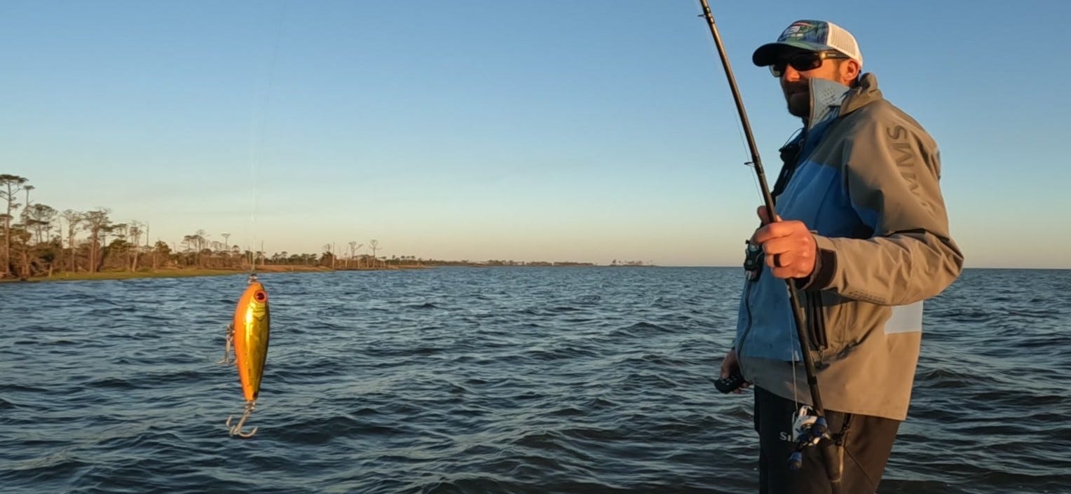 Angler showing topwater lure