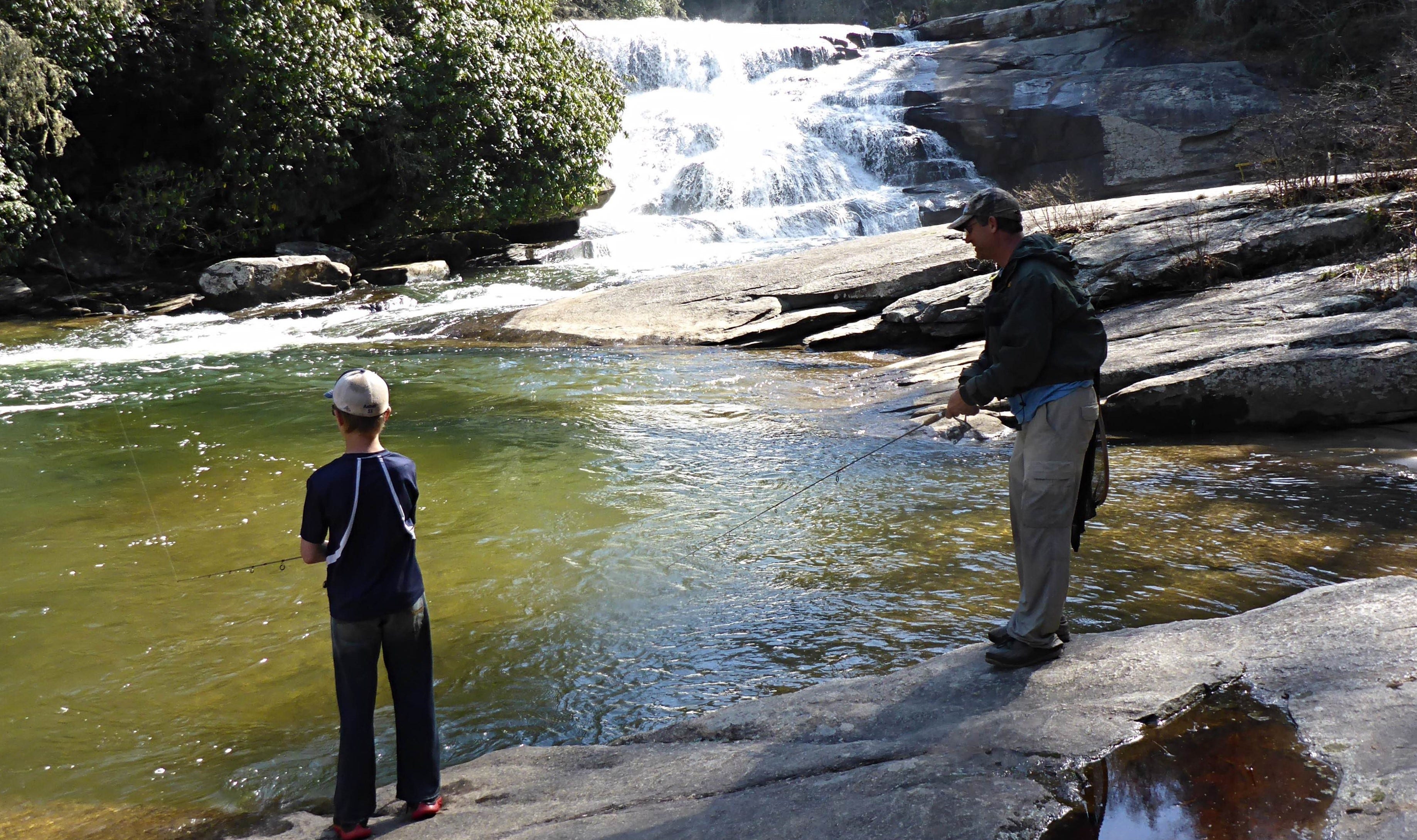 father and son trout fishing