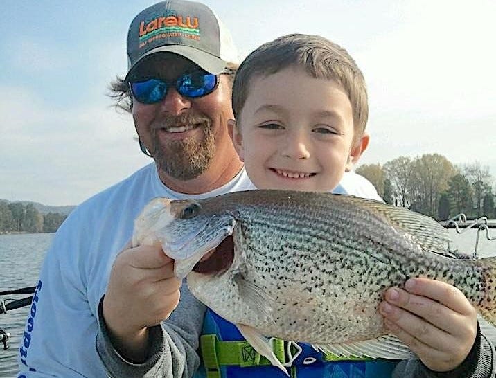 Lee Pitts and child with crappie