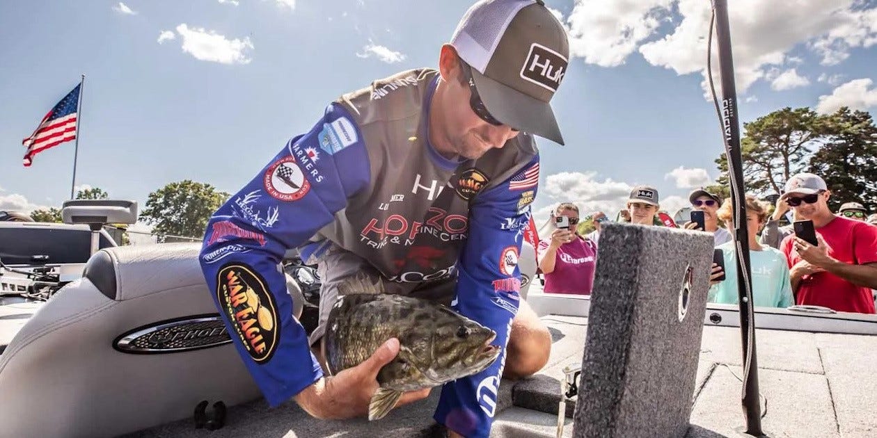 Luke Palmer with smallmouth bass